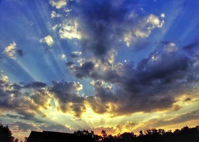 Low angle view of cloudy sky at sunset