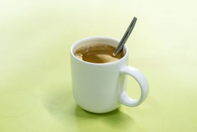 Close-up of coffee cup against black background