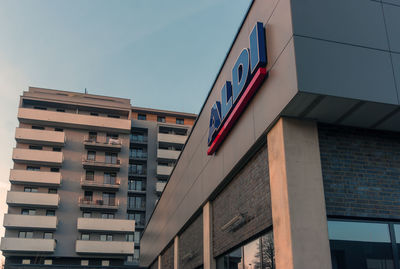 Low angle view of buildings in city against clear sky