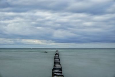 Scenic view of pier over sea against sky