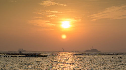 View of calm sea at sunset