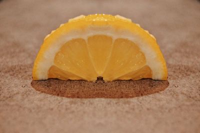 Close-up of orange slice on table