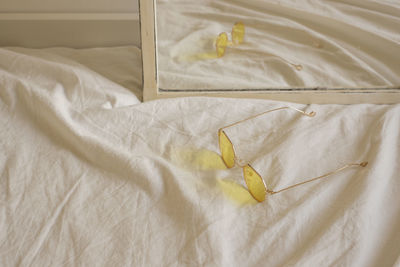 High angle view of white blanket on bed at home