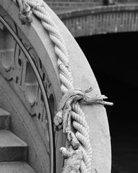 Close-up of rope tied to railing