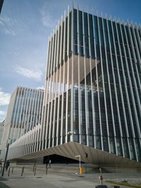 Low angle view of modern building against sky in city