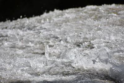 Close-up of water splashing in sea