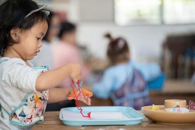 Cute little girl playing at nursery.