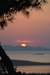 Scenic view of sea against sky at sunset