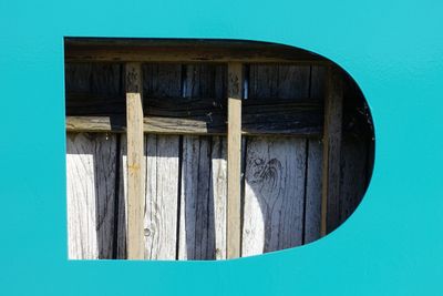 Close-up of closed door of building against blue sky