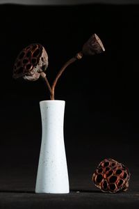 Close-up of cake against black background
