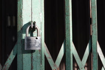 Close-up of padlocks on fence