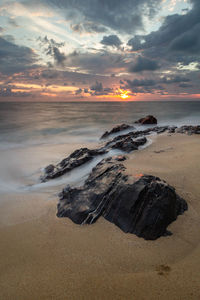 Scenic view of sea against sky during sunset