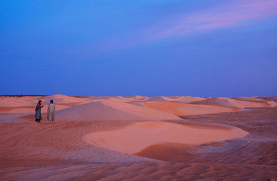 Scenic view of desert against clear sky