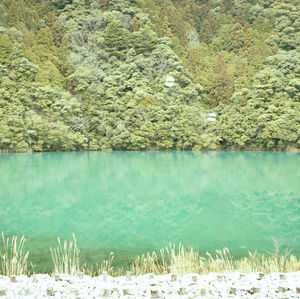 Scenic view of lake with mountains in background
