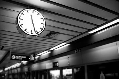 Low angle view of illuminated railroad station at night