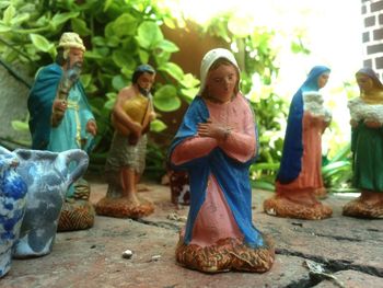 Close-up of statues on walkway