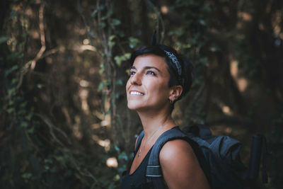 Portrait of smiling young woman looking away