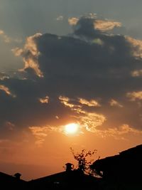 Silhouette landscape against sky during sunset