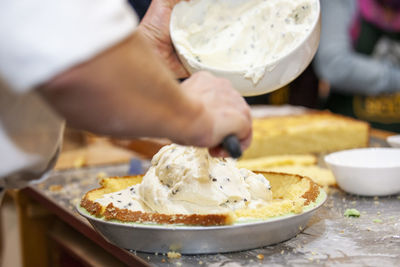 Cropped image of person preparing food