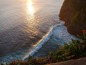 High angle view of sea shore during sunset