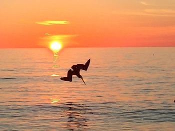 Scenic view of sunset over lake