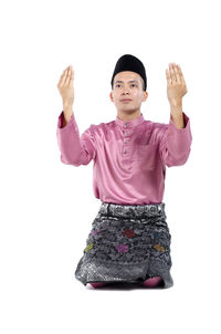 Portrait of man standing against white background