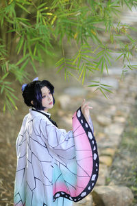 Side view of woman standing outdoors