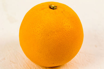 Close-up of orange slice on table