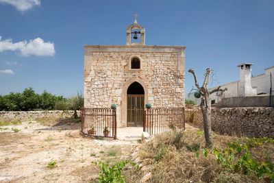 Exterior of historic building against sky