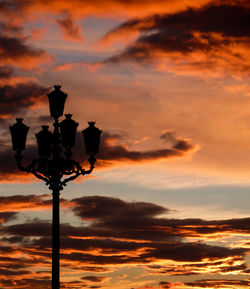 Low angle view of cloudy sky at sunset