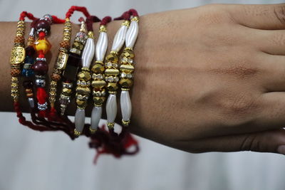 Close-up of man holding hands rakhi on hand rakshabandhan festival celebration