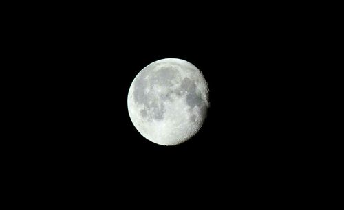 Low angle view of moon against clear sky at night