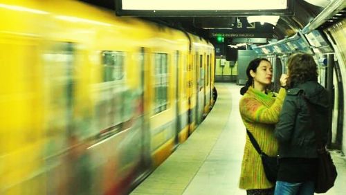 Woman looking at railroad station