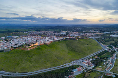 Elvas cityscape drone aerial panoramic view with beautiful green landscape of alentejo, in portugal