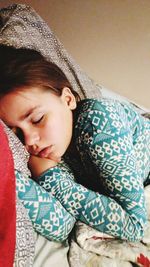 Portrait of a girl sleeping on bed