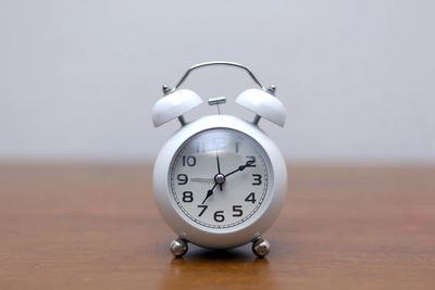 Close-up of clock on table