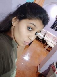 Close-up portrait of baby girl at home