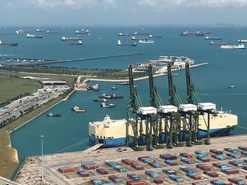 High angle view of harbor by sea against sky