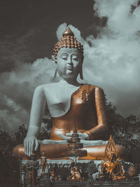 Buddha statues against sky