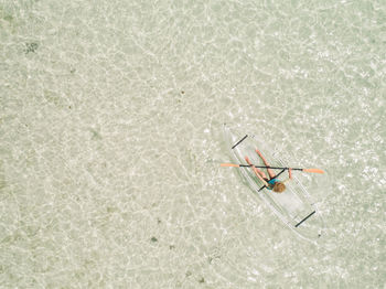 High angle view of woman in inflatable raft at sea