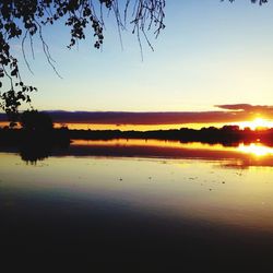 Scenic view of lake at sunset