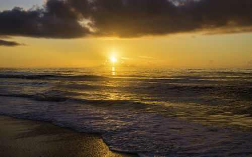 Scenic view of sea against sky during sunset