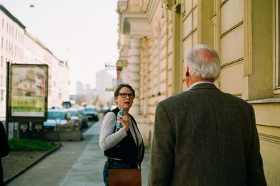 Rear view of a couple in city