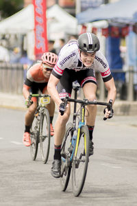 Woman riding bicycle on city