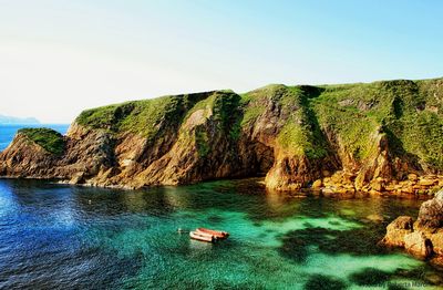 Scenic view of sea against blue sky