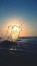 Scenic view of sea at sunset