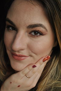 Portrait of beautiful young woman with make-up