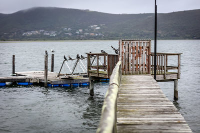 Pier over sea against sky