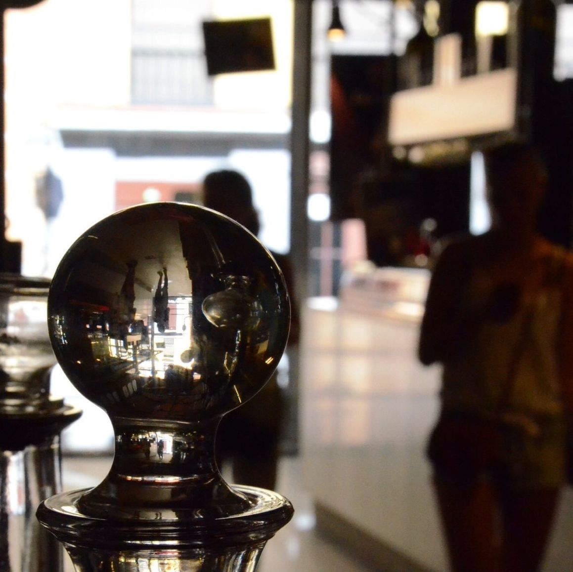 indoors, glass - material, transparent, focus on foreground, table, window, reflection, close-up, selective focus, still life, home interior, glass, restaurant, lighting equipment, illuminated, architecture, incidental people, technology, wineglass, no people