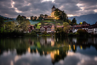 Reflection of illuminated built structures in river